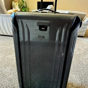 TUMI checked bag!